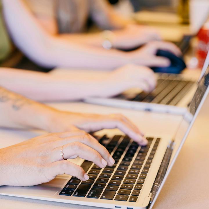 Media card - student typing on computer